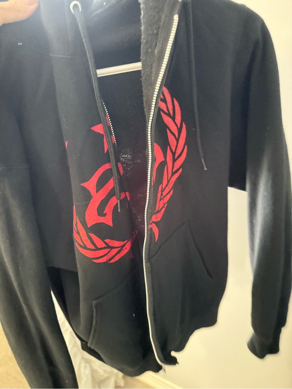 TC Black Zip-Up Hoodie with Red Crest Graphic